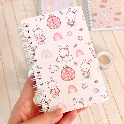 Bella and Rainbows | Spiral Grid Notebook (SNB01-POCKET)